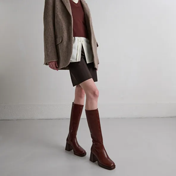 Platform boots in distressed brown leather